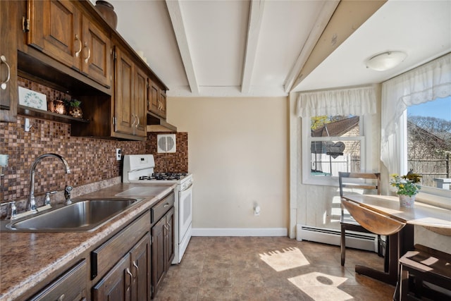 244 Laverne Ave, Holbrook, NY 11741 - kitchen featuring gas range gas stove, a sink, tasteful backsplash, a baseboard heating unit, and baseboards
