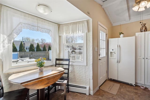244 Laverne Ave, Holbrook, NY 11741 - kitchen featuring white refrigerator with ice dispenser, vaulted ceiling, a ceiling fan, baseboard heating, and tile patterned flooring