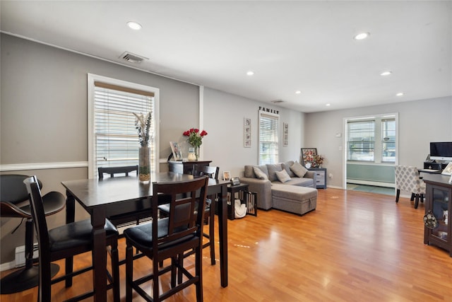 244 Laverne Ave, Holbrook, NY 11741 - dining room with a baseboard heating unit, recessed lighting, and light wood finished floors