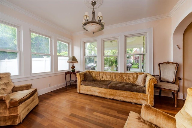136 Linden St, Woodmere, NY 11598 - living room with arched walkways, wood finished floors, baseboards, ornamental molding, and a chandelier