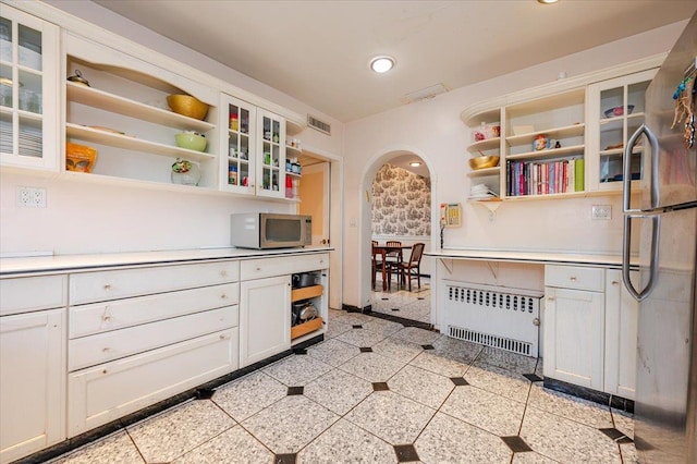 136 Linden St, Woodmere, NY 11598 - kitchen featuring radiator, open shelves, stainless steel appliances, built in desk, and recessed lighting