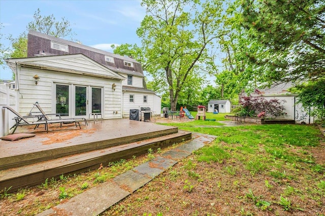136 Linden St, Woodmere, NY 11598 - back of property featuring a deck and a lawn