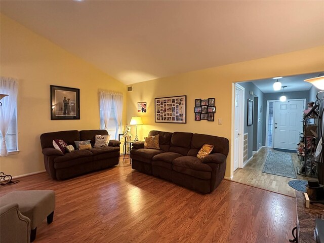 5 Baldwin Ct, Ridge, NY 11961 - living room with wood finished floors, lofted ceiling, and baseboards