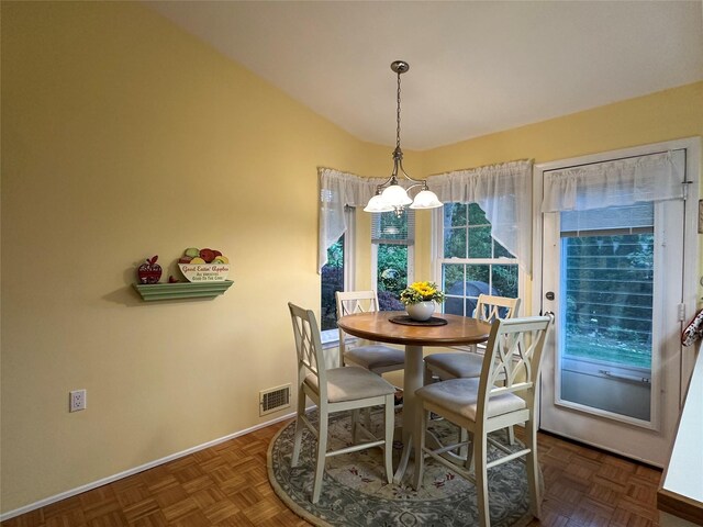 5 Baldwin Ct, Ridge, NY 11961 - dining area with a chandelier, baseboards, and lofted ceiling