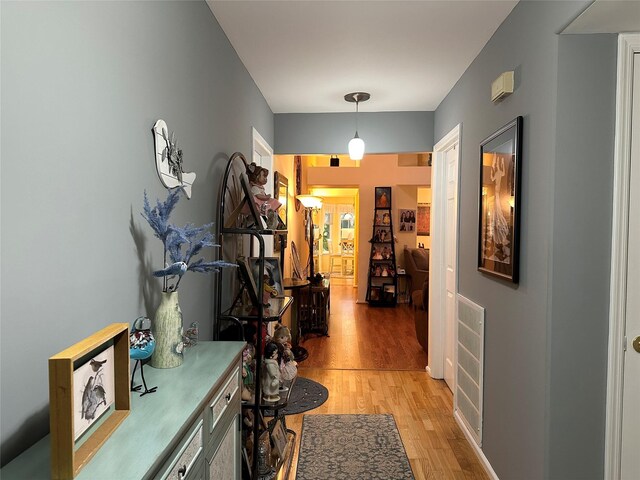 5 Baldwin Ct, Ridge, NY 11961 - hall with light wood-style floors