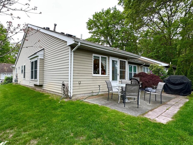 5 Baldwin Ct, Ridge, NY 11961 - back of house with a patio and a lawn