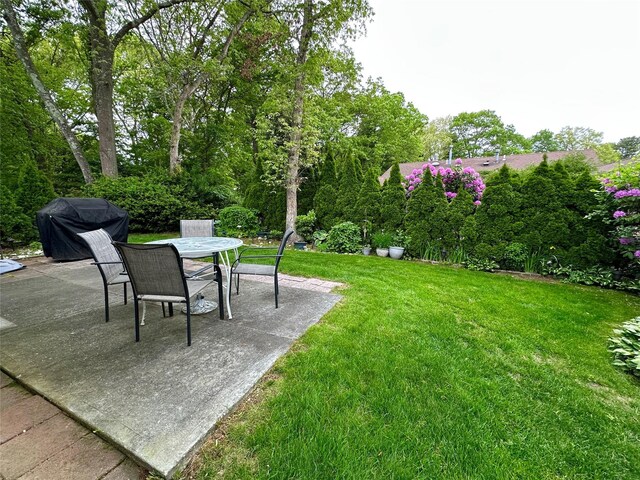 5 Baldwin Ct, Ridge, NY 11961 - view of green lawn featuring a patio and outdoor dining area