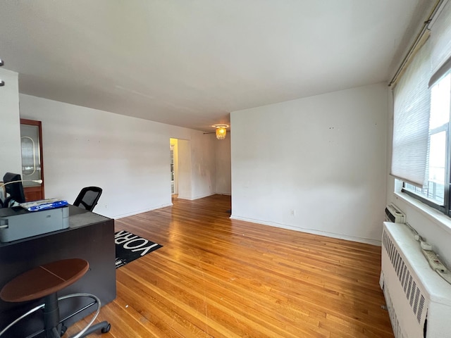 69-50 138th St Unit A, Flushing, NY 11367 - home office with light wood-style floors and radiator