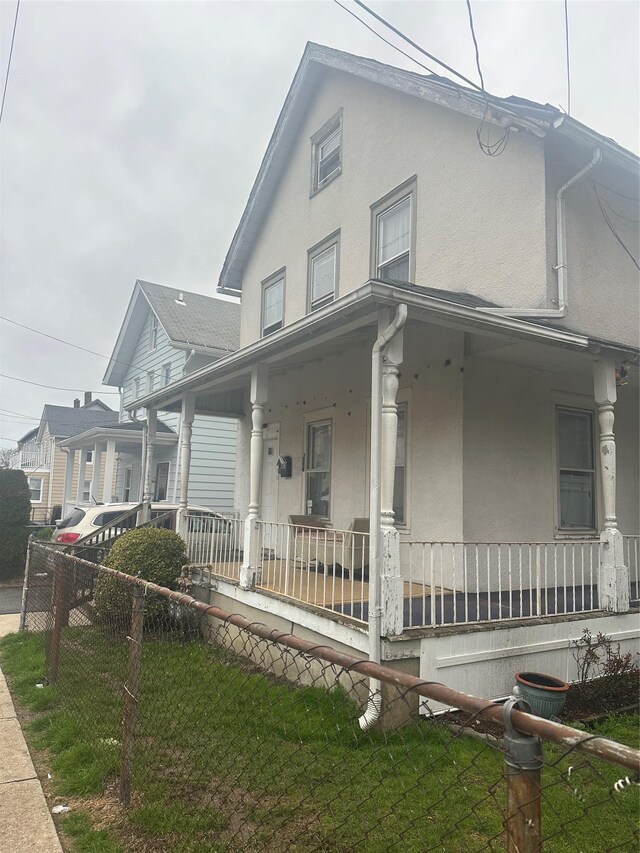 43 Oak St, Port Chester, NY 10573 - view of front of home featuring a porch and stucco siding