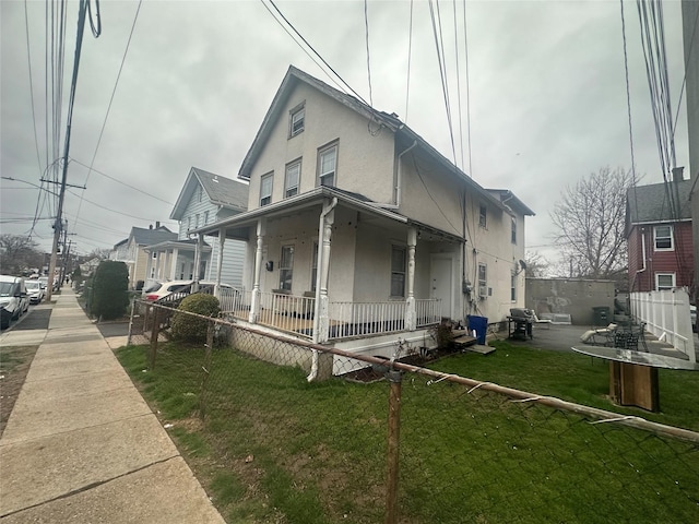 43 Oak St, Port Chester, NY 10573 - view of front of home with a porch and stucco siding