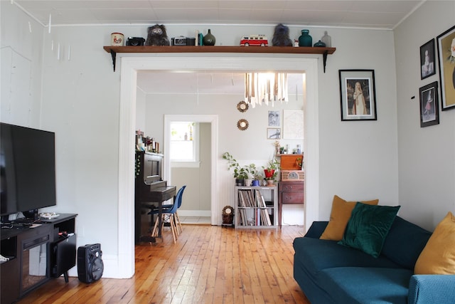 76 Foxhall Ave, Kingston, NY 12401 - living room with light wood-style floors, crown molding, and baseboards