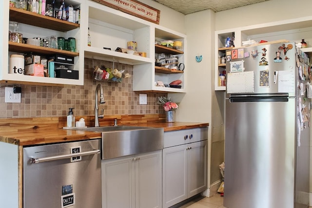 76 Foxhall Ave, Kingston, NY 12401 - kitchen with butcher block countertops, appliances with stainless steel finishes, open shelves, and a sink
