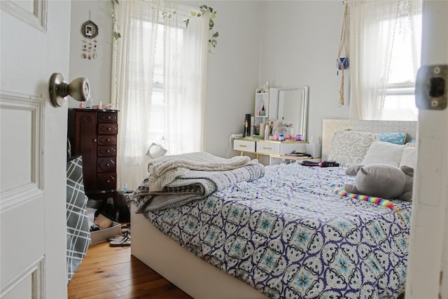 76 Foxhall Ave, Kingston, NY 12401 - bedroom with multiple windows and wood finished floors