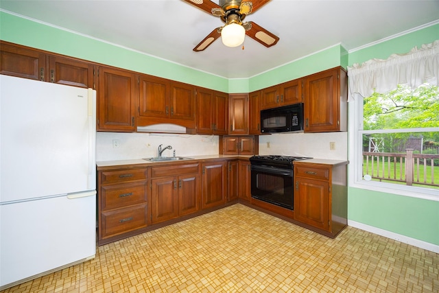 7 Sycamore Dr, Hyde Park, NY 12538 - kitchen featuring freestanding refrigerator, black microwave, stove, a sink, and light countertops