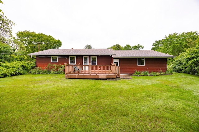 7 Sycamore Dr, Hyde Park, NY 12538 - rear view of house with a deck and a lawn