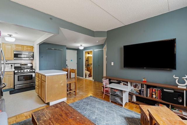 102 Bradhurst Ave Unit 906, New York Manhattan, NY 10039 - living room featuring a textured ceiling