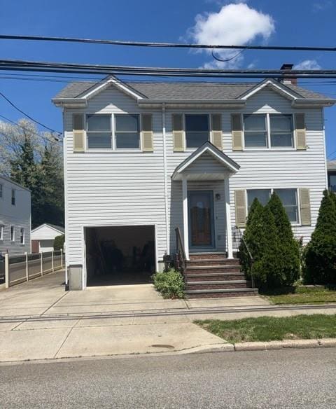 1113 5th Ave, New Hyde Park, NY 11040 - view of front of house featuring an attached garage and driveway