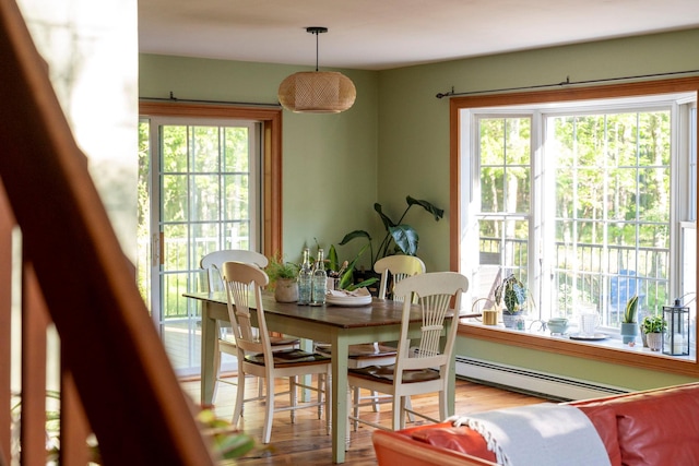 1401 State Route 28a, Hurley, NY 12491 - dining room featuring a baseboard heating unit and wood finished floors