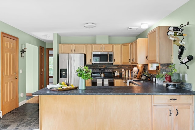1401 State Route 28a, Hurley, NY 12491 - kitchen with stainless steel appliances, light brown cabinetry, a sink, and dark countertops
