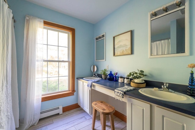 1401 State Route 28a, Hurley, NY 12491 - bathroom featuring baseboard heating, vanity, and wood finished floors