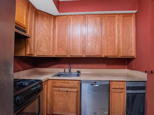 105 Surf Dr Unit 25, Bronx, NY 10473 - kitchen featuring stainless steel dishwasher, black range with gas stovetop, a sink, and light countertops