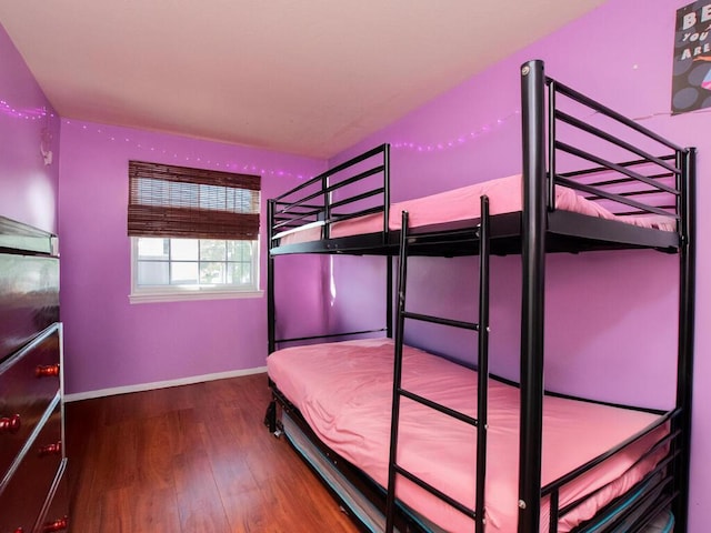 105 Surf Dr Unit 25, Bronx, NY 10473 - unfurnished bedroom with wood finished floors and baseboards