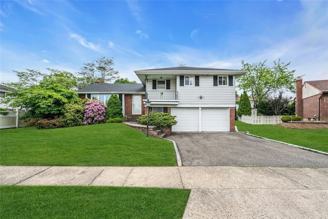150 Northern Pkwy W, Plainview, NY 11803 - tri-level home featuring brick siding, asphalt driveway, an attached garage, and a balcony