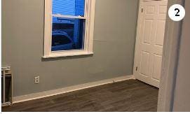 17 Chestnut St, Yonkers, NY 10701 - spare room with baseboards and dark wood-type flooring