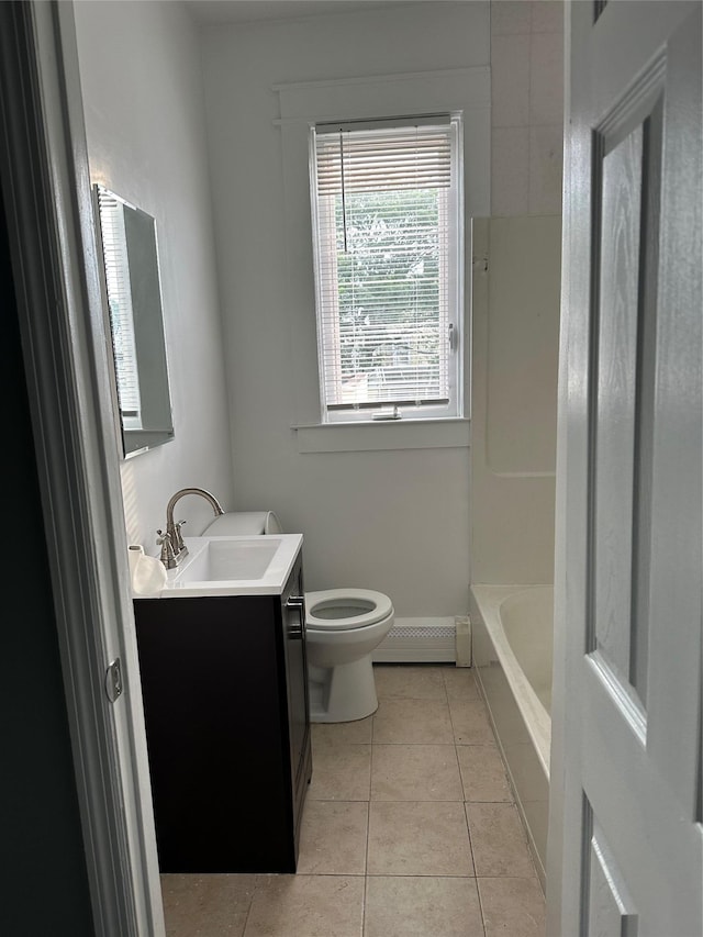 17 Chestnut St, Yonkers, NY 10701 - bathroom featuring baseboard heating, vanity, toilet, tile patterned floors, and bathtub / shower combination