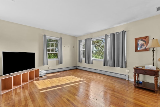 37 Lakeview Rd, Carmel, NY 10512 - unfurnished living room with hardwood / wood-style flooring, a baseboard heating unit, and baseboards