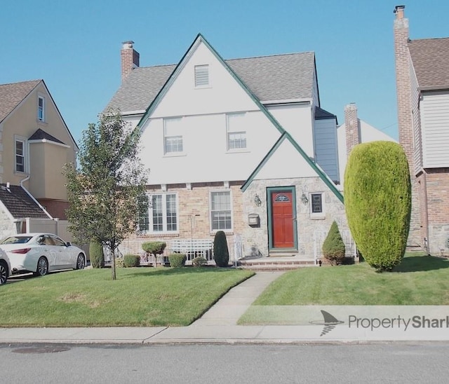 24-06 169th St, Whitestone, NY 11357 - view of front facade featuring a front yard and roof with shingles