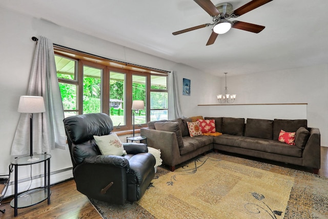 33 Greentree Dr N, Hyde Park, NY 12538 - living room with a chandelier, wood finished floors, a ceiling fan, and a baseboard radiator