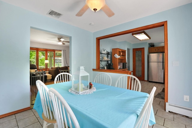 33 Greentree Dr N, Hyde Park, NY 12538 - dining room featuring a ceiling fan, a baseboard radiator, light tile patterned floors, and baseboards