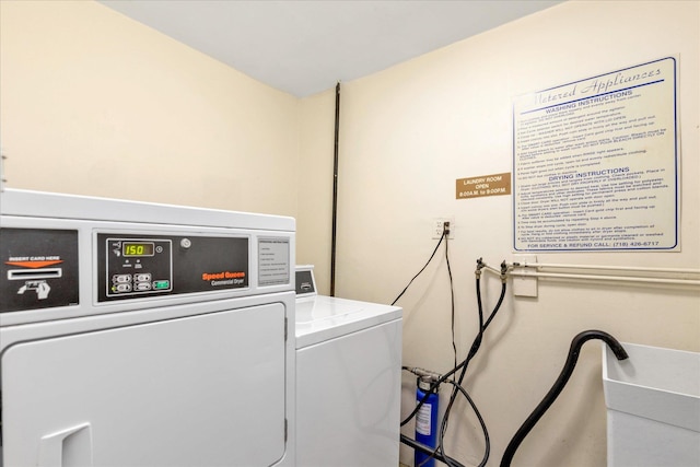 333 E Broadway Unit 1D, Long Beach, NY 11561 - laundry room with a sink and washing machine and dryer
