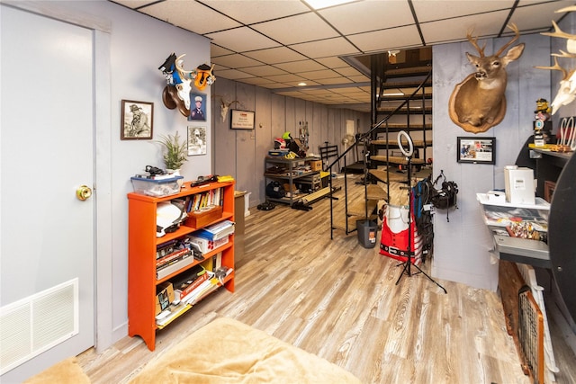 26 Stacey Dr, Monticello, NY 12701 - interior space with wood finished floors, stairway, and a drop ceiling