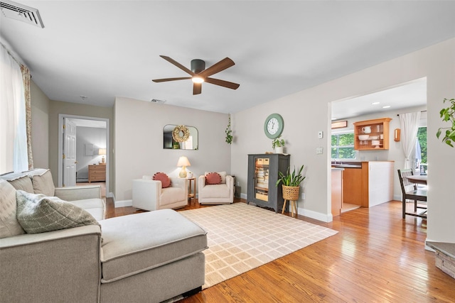 65 Awosting Rd, Pine Bush, NY 12566 - living room featuring a ceiling fan, light wood-style floors, and baseboards