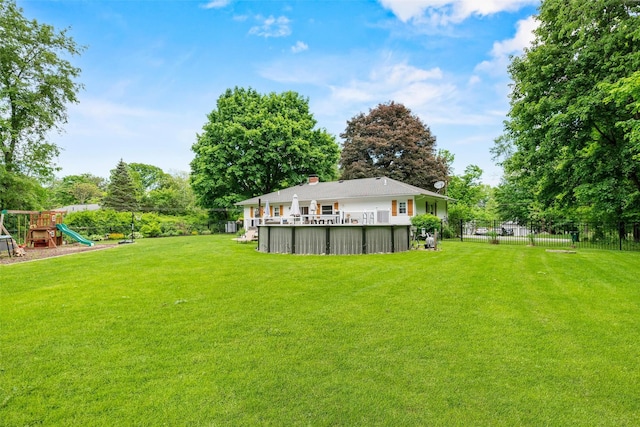 65 Awosting Rd, Pine Bush, NY 12566 - view of yard with a playground, a swimming pool, and view of wooded area