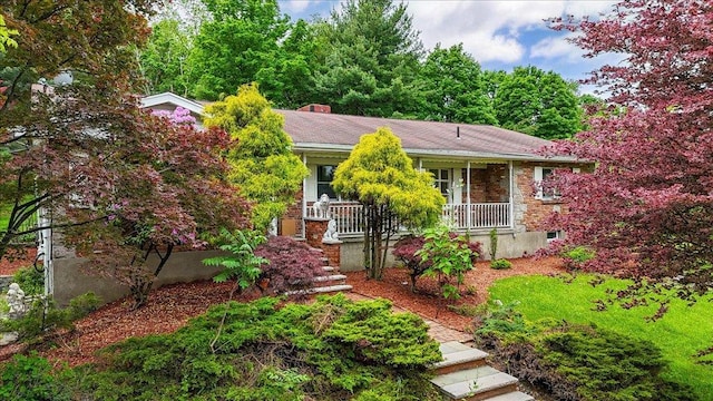 665 State Route 94 N, Warwick, NY 10990 - view of front of house with a porch and brick siding