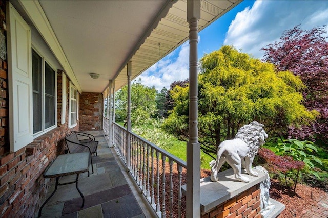 665 State Route 94 N, Warwick, NY 10990 - covered porch with view of scattered trees