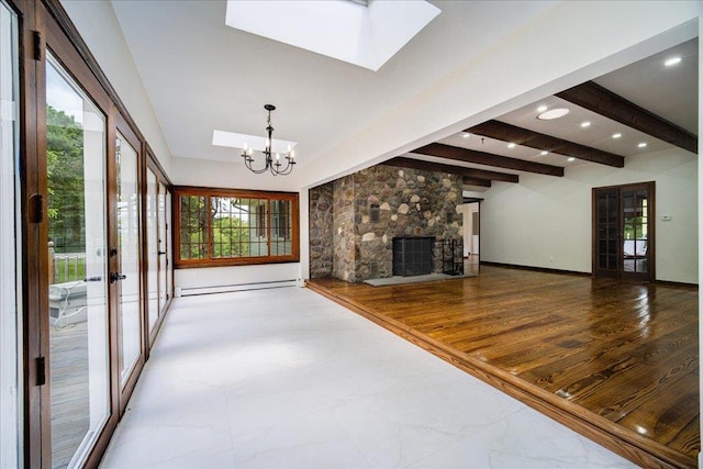 665 State Route 94 N, Warwick, NY 10990 - unfurnished living room featuring a fireplace, french doors, a skylight, a baseboard heating unit, and beamed ceiling