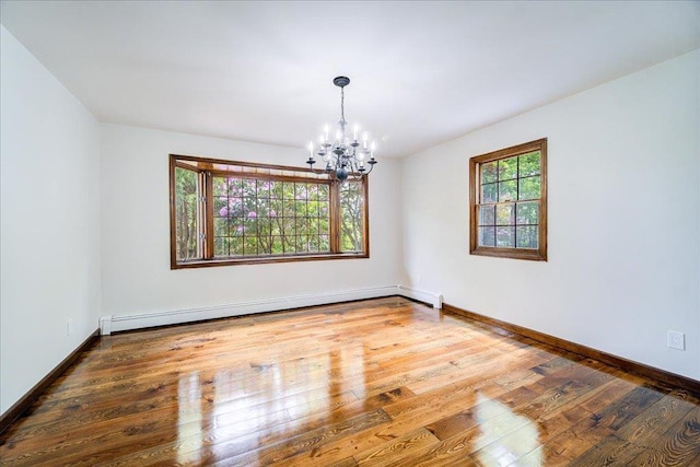 665 State Route 94 N, Warwick, NY 10990 - unfurnished room with a chandelier, a baseboard heating unit, wood-type flooring, and baseboards