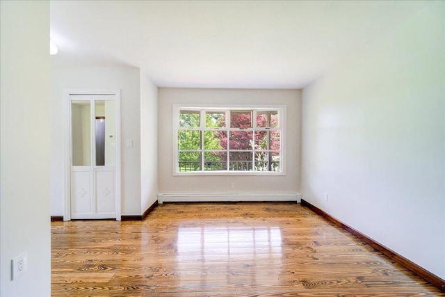 665 State Route 94 N, Warwick, NY 10990 - unfurnished room featuring baseboard heating, wood finished floors, and baseboards