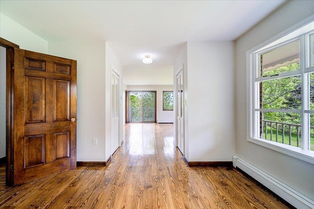 665 State Route 94 N, Warwick, NY 10990 - hallway with a baseboard radiator, wood finished floors, and baseboards