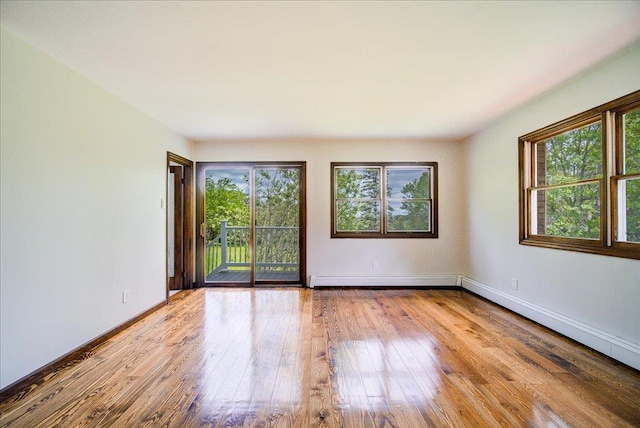 665 State Route 94 N, Warwick, NY 10990 - unfurnished room with healthy amount of natural light, hardwood / wood-style flooring, baseboards, and a baseboard radiator