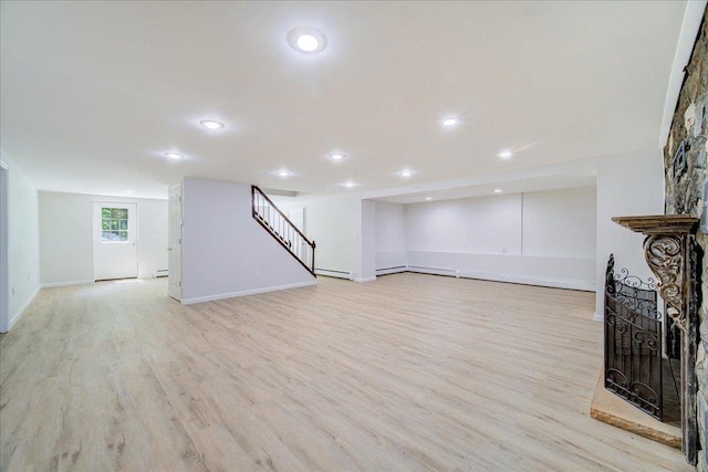 665 State Route 94 N, Warwick, NY 10990 - unfurnished living room with stairs, light wood-style flooring, baseboards, recessed lighting, and baseboard heating