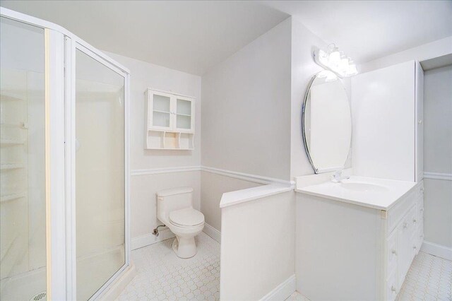665 State Route 94 N, Warwick, NY 10990 - bathroom with vanity, a shower stall, toilet, baseboards, and tile patterned floors
