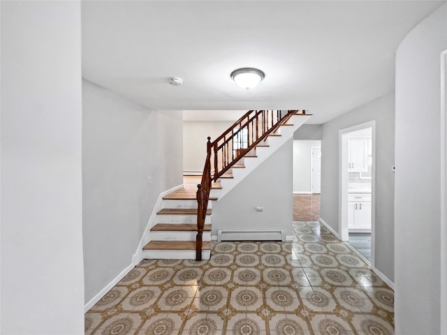 19 Leaf Ave, Central Islip, NY 11722 - staircase featuring a baseboard radiator and baseboards