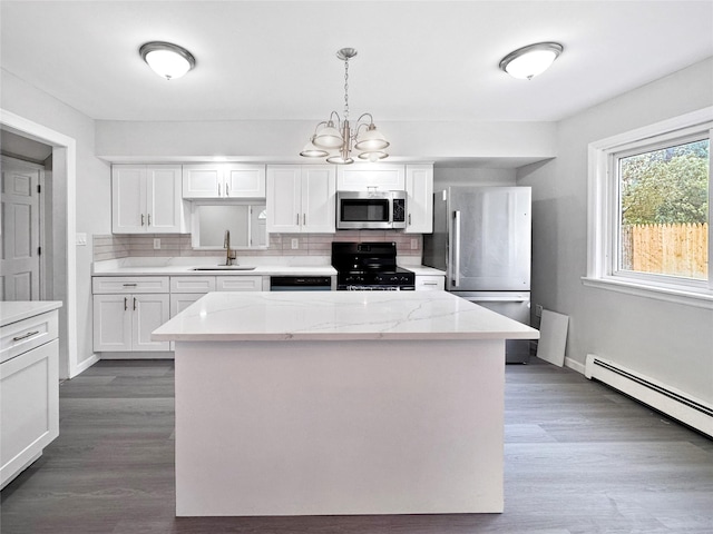 19 Leaf Ave, Central Islip, NY 11722 - kitchen with stainless steel appliances, a sink, backsplash, and white cabinets