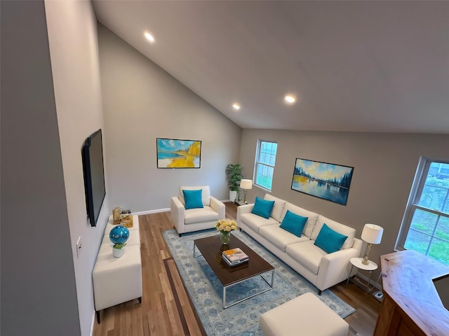 19 Leaf Ave, Central Islip, NY 11722 - living room with lofted ceiling, wood finished floors, recessed lighting, and baseboards