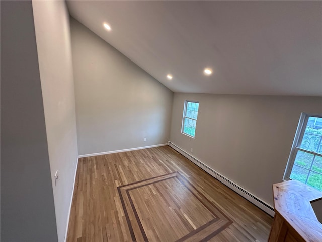 19 Leaf Ave, Central Islip, NY 11722 - unfurnished room with a baseboard heating unit, healthy amount of natural light, lofted ceiling, wood finished floors, and recessed lighting